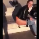 A girl is recorded by a friend as she takes a shit along the curb of a public street and then wipes her ass. Poop action is clearly shown. Vertical format video. Over a minute.